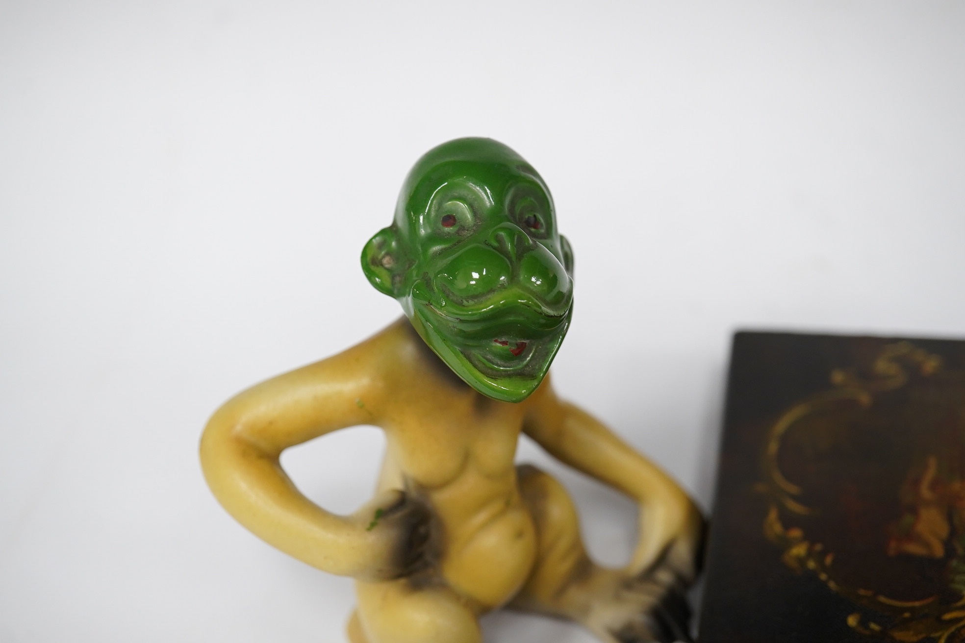 A Victorian papier mache box, a foreign porcelain novelty monkey and cut steel buttons, largest 13cm wide. Condition - fair